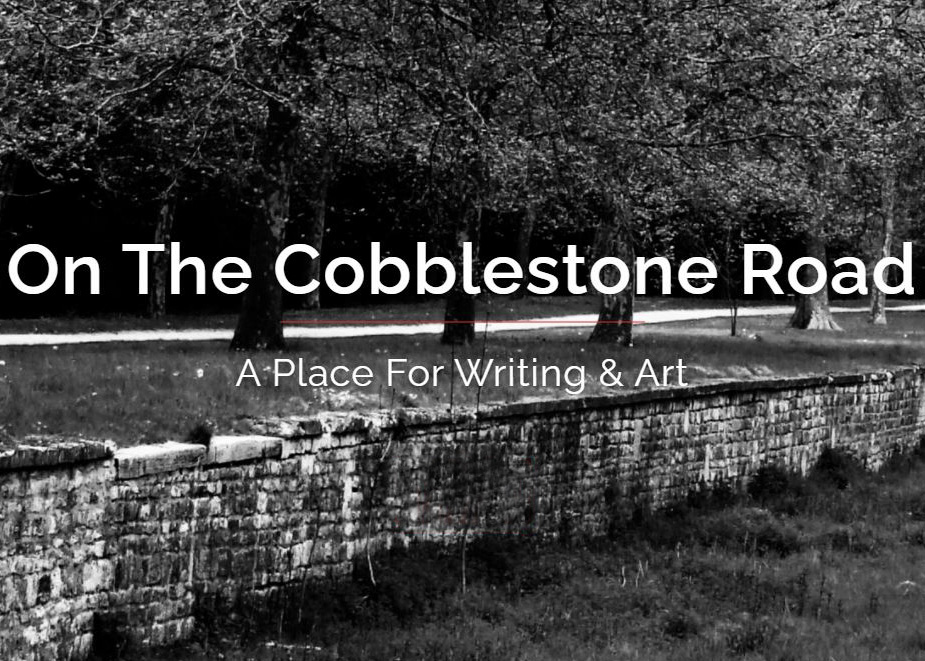 On the Cobblestone Road black and white photograph stone wall