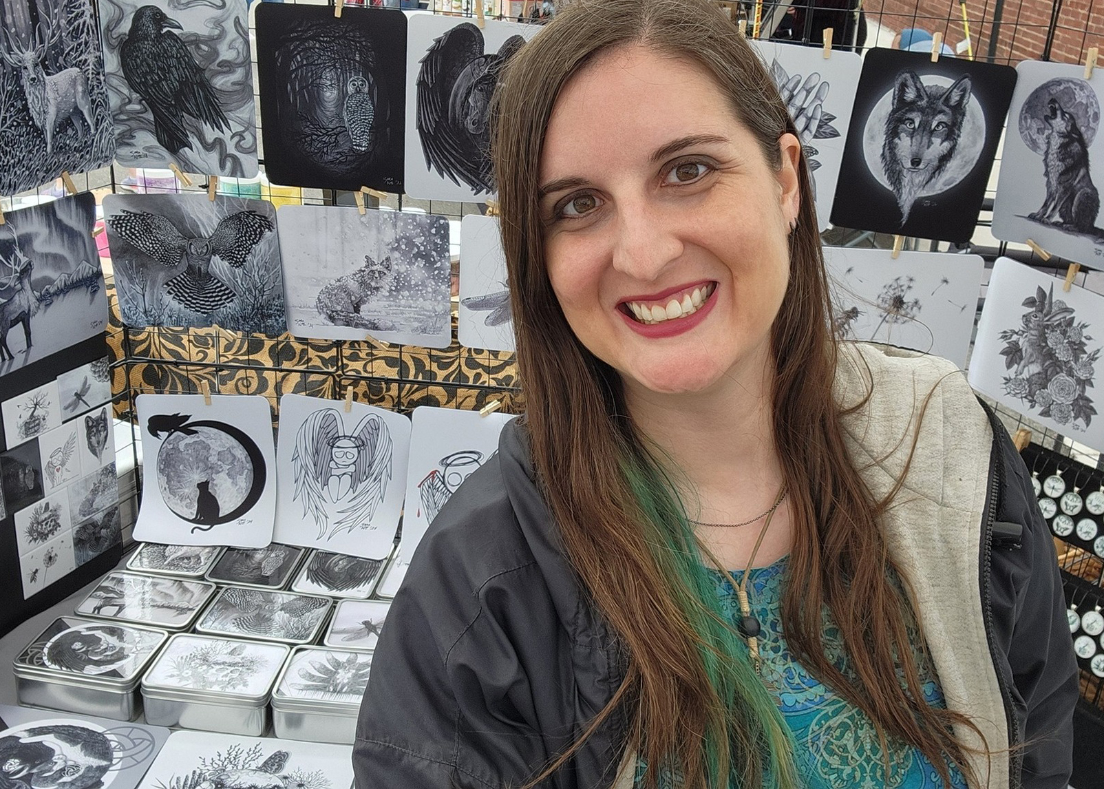Sara A. Noe in front of her art